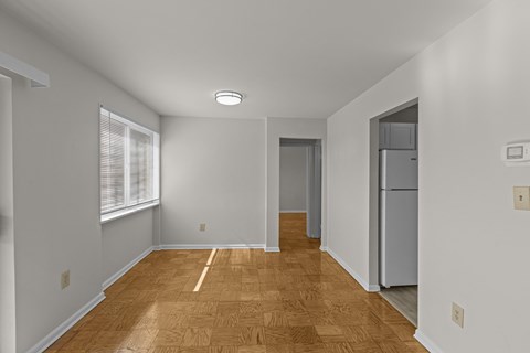 A room with wooden flooring and white walls.at Kensington House, Maryland