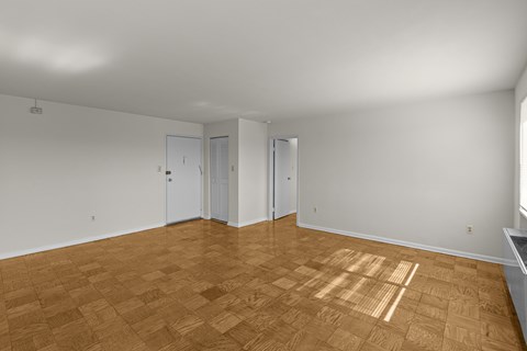 A room with wooden flooring and white walls.at Kensington House, Kensington, 20895