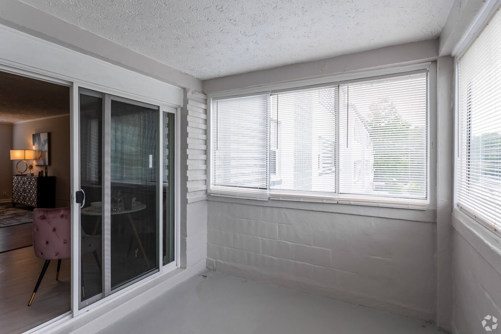 A room with a sliding glass door leading to a balcony.at Greenbelt Properties, Maryland, 20770