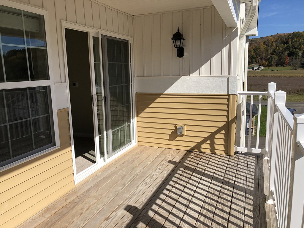 a view of the deck from the back of the house