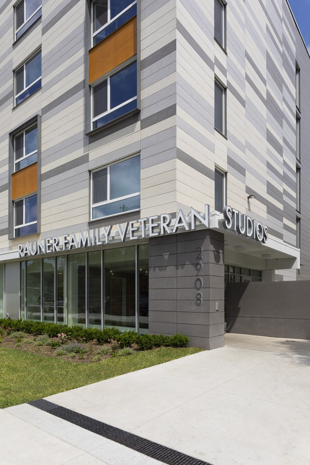 an office building with a sidewalk in front of it