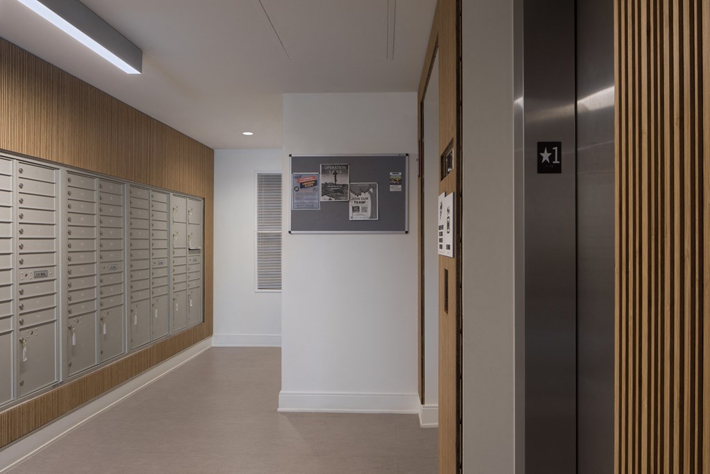 a hallway with lockers and a poster on the wall