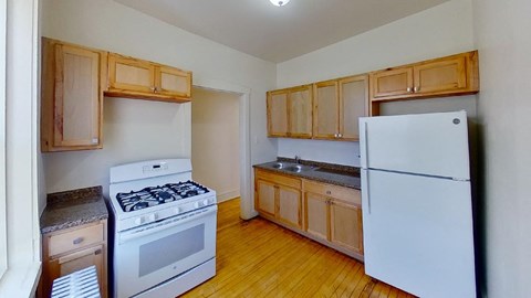 a kitchen with a stove and a refrigerator