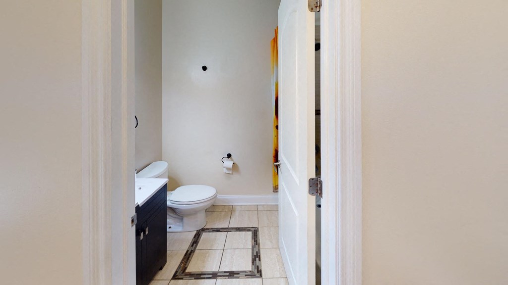 a bathroom with a toilet and a sink