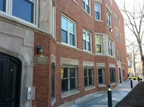 a brick building with a sign on the side of it
