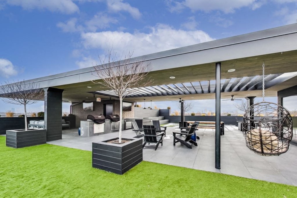 the patio of the home has a retractable roof