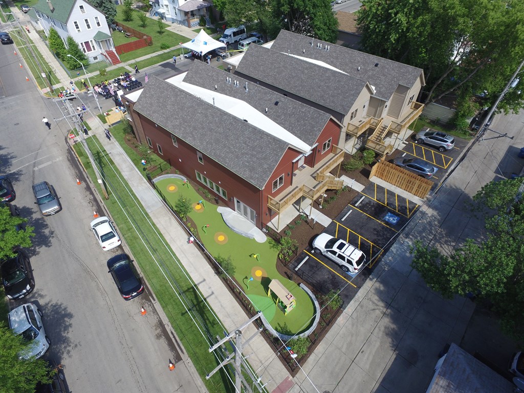 an aerial view of a yard in front of a house