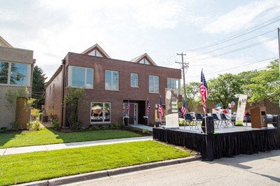 a building with a yard and a stage in front of it