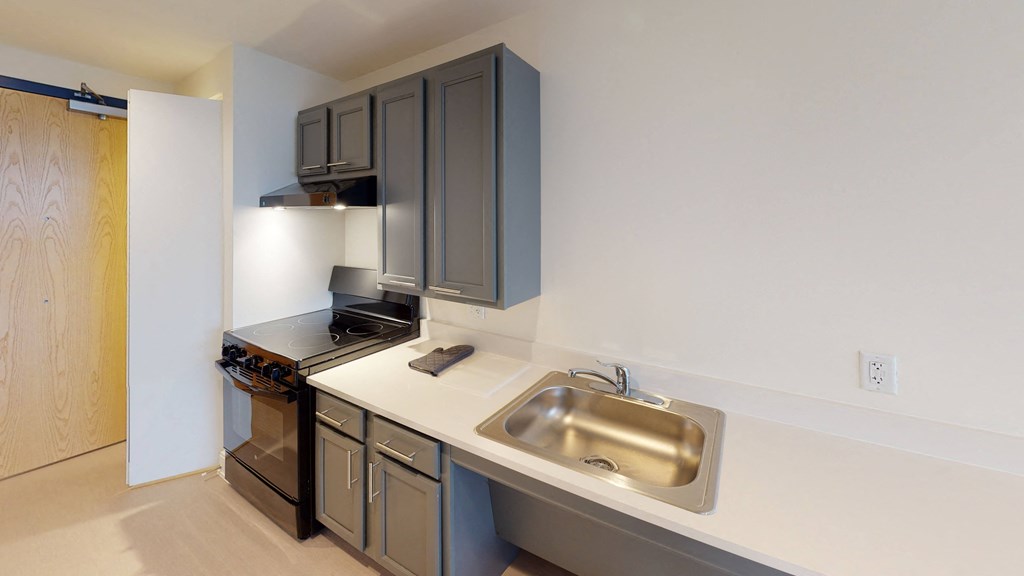 a kitchen with stainless steel appliances and a sink
