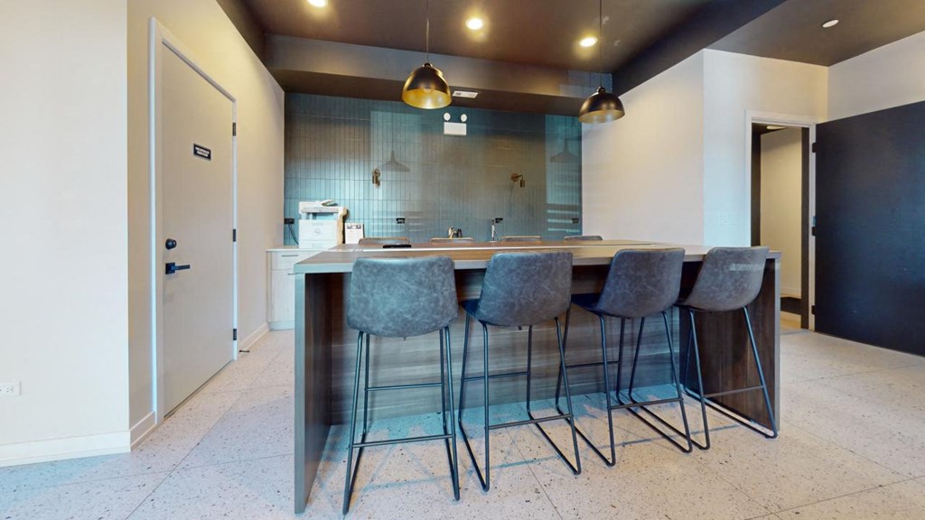a kitchen with an island and bar stools
