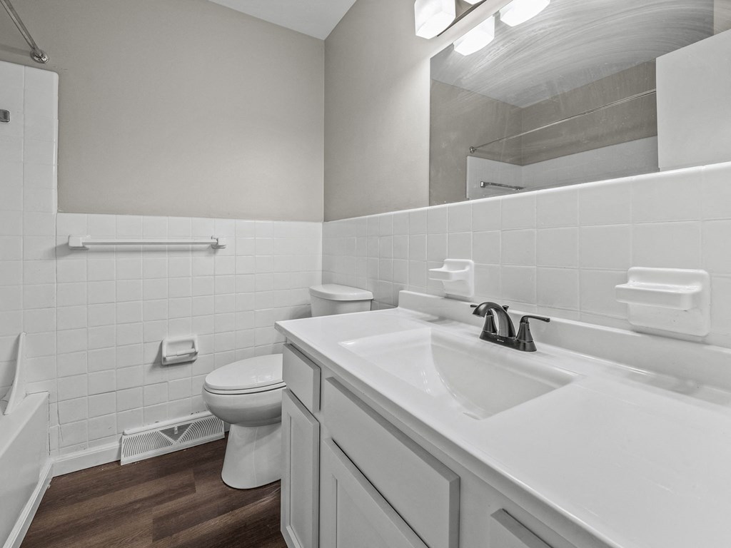 a bathroom with a toilet sink and bathtub