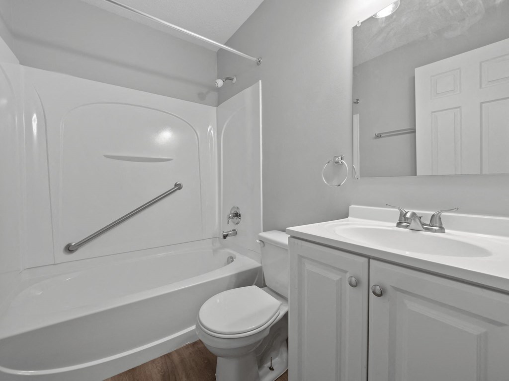 a bathroom with a sink toilet and a tub