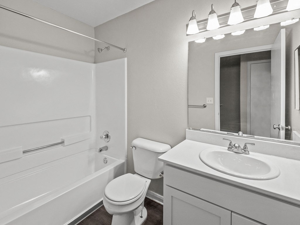 a bathroom with a sink toilet and a bath tub