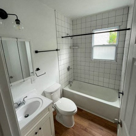 a bathroom with a sink toilet and a bath tub
