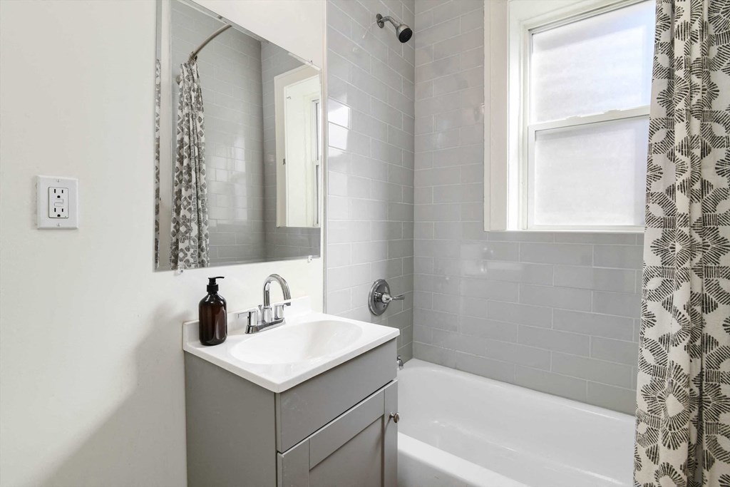 a bathroom with a sink and a bathtub