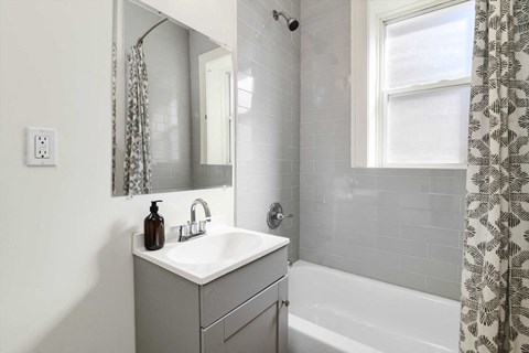 a bathroom with a sink and a bathtub