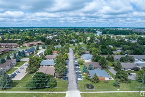 an aerial view of a neighborhood with houses and trees
