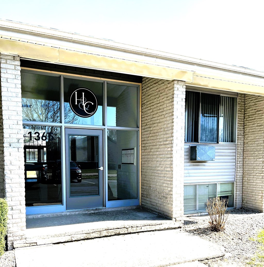 the front of a building with a glass door