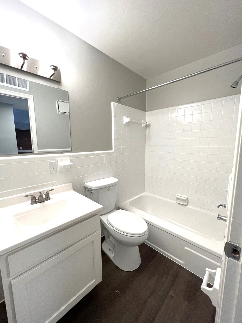 a bathroom with a sink toilet and a bath tub