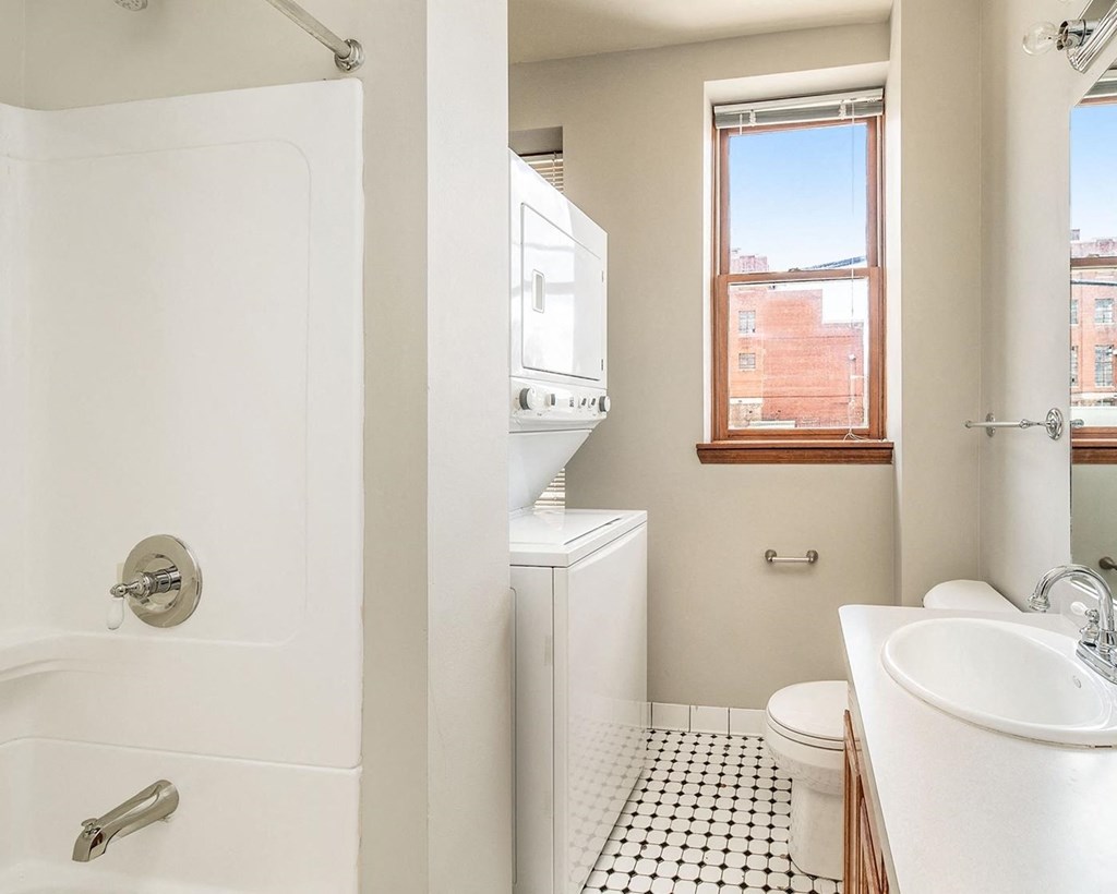 a bathroom with a toilet sink and bathtub