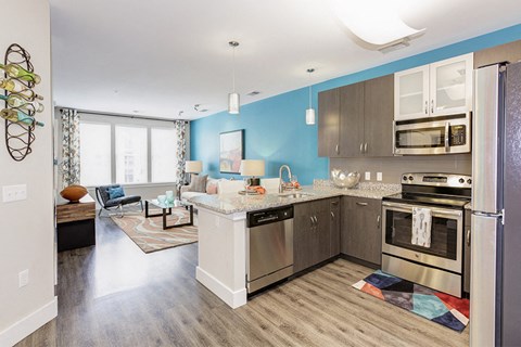 a kitchen with stainless steel appliances and a counter top