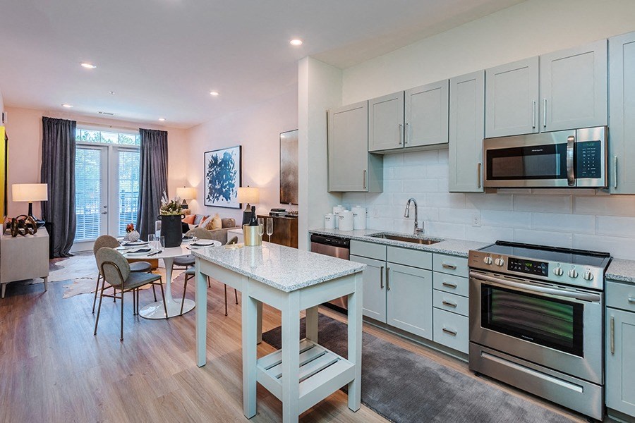 Homes feature luxury vinyl plank flooring and expansive layouts