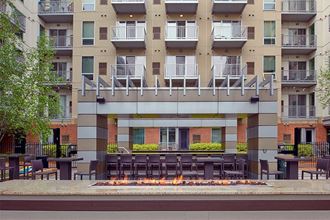 Courtyard with grilling area Minneapolis, MN Apartments in Uptown | Flux Apartments | fire feature - Photo Gallery