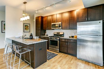 Midtown Greenway Apartments For Rent in Minneapolis, MN | Junction Flats | granite countertops - Photo Gallery 12