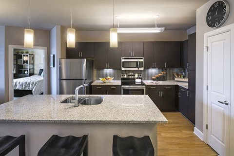a kitchen with a marble counter top