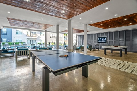 Covered game room with ping pong and billiards table