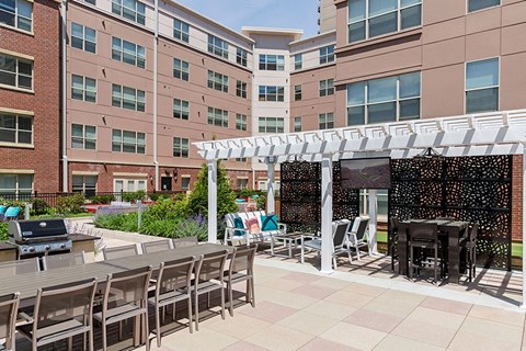 Entertain at the outdoor lounge complete with TVs, grilling station and dining areas