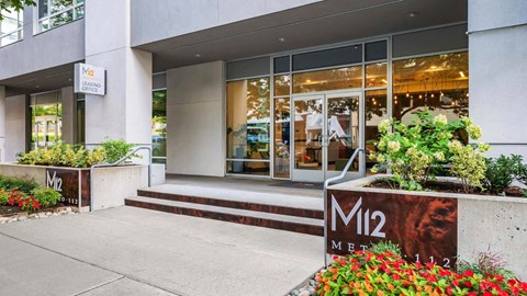 The front of a building with the name M12 on it.