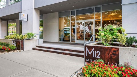 The front of a building with a sign that says M12.