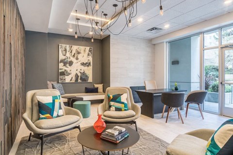 a living room and dining room with chairs and a table