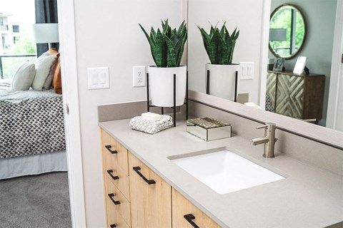 Bathrooms feature contemporary fixtures, double vanities and framed mirrors