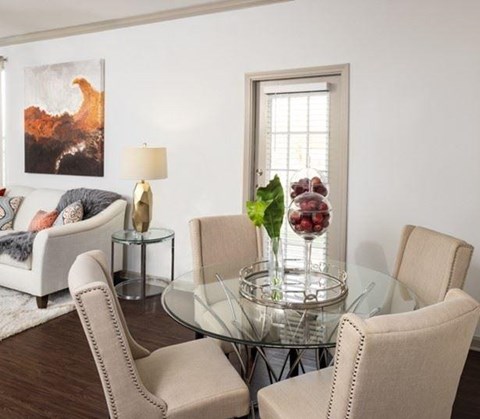 Dining and living room feature luxury vinyl plank flooring