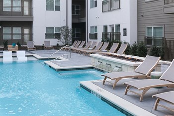 Apartments for Rent in Dallas, TX - Larq Henderson Relaxing water and fire feature