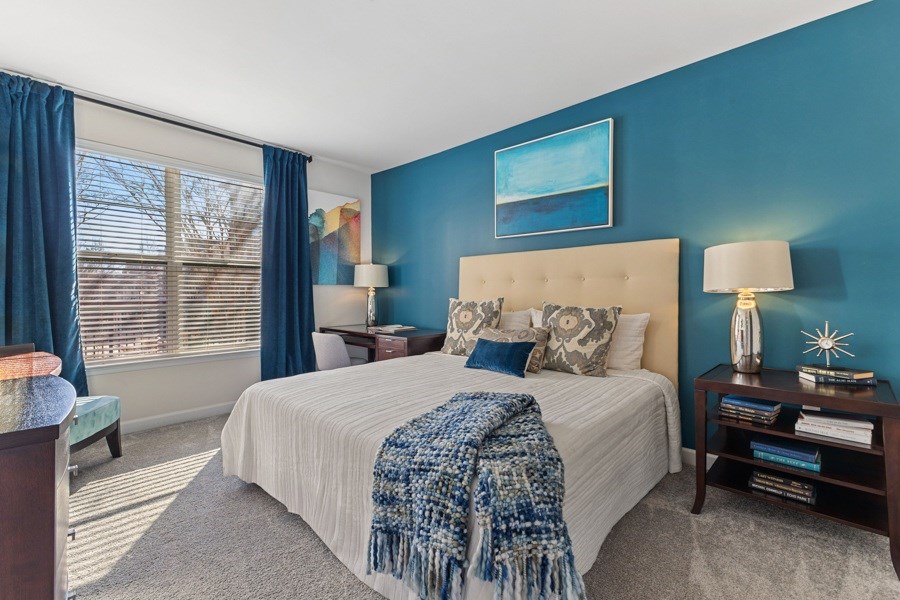 Plush carpeting with padding in bedrooms along with 2' plantation blinds