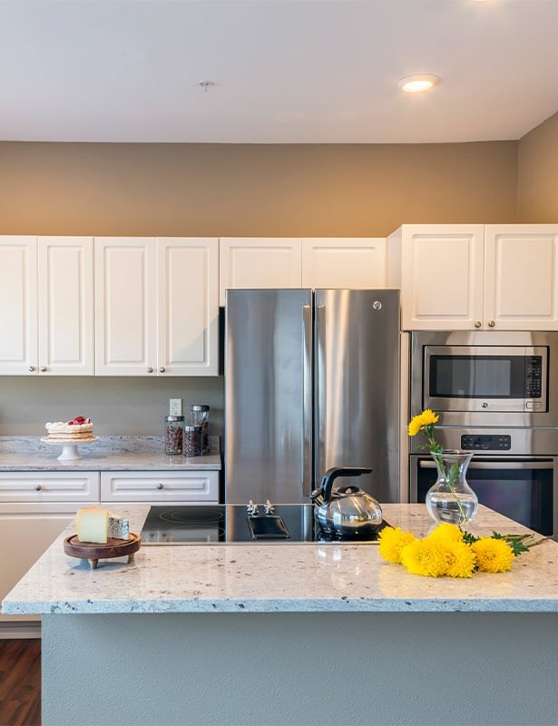 Kitchens feature custom touches like kitchen islands and breakfast bars