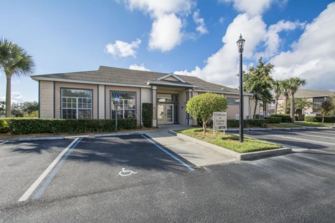 A building with a parking lot in front of it.