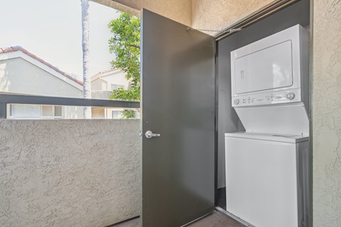 a washing machine and dryer on the side of a door