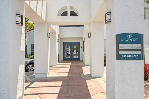 a building with a blue door and a sign that says