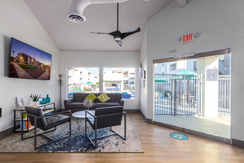 a living room with a couch and a coffee table and a sliding glass door