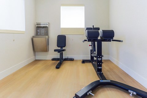 two chairs in a gym room with a window