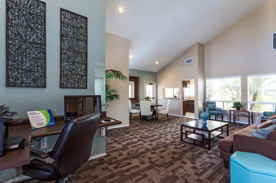 a living room filled with furniture and a flat screen tv