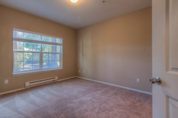 an empty room with a large window - Photo Gallery 5