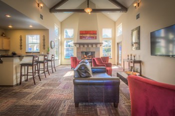 a living room with couches chairs and a fireplace - Photo Gallery 10