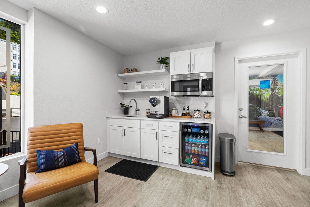 a kitchen with a refrigerator and a microwave