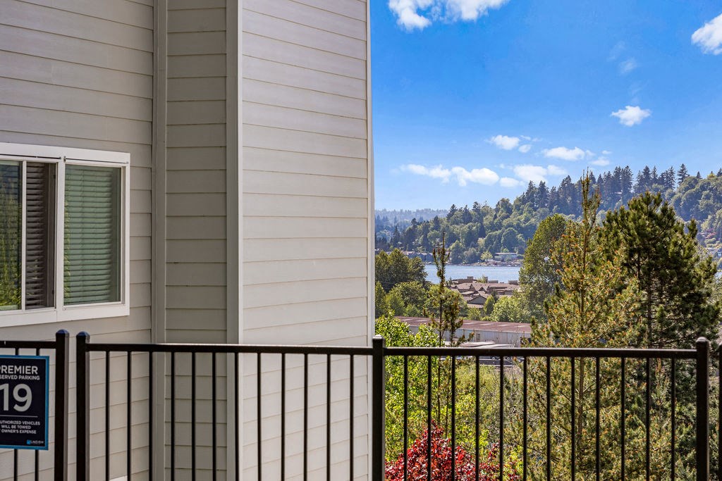 a balcony with a view of a city and a river
