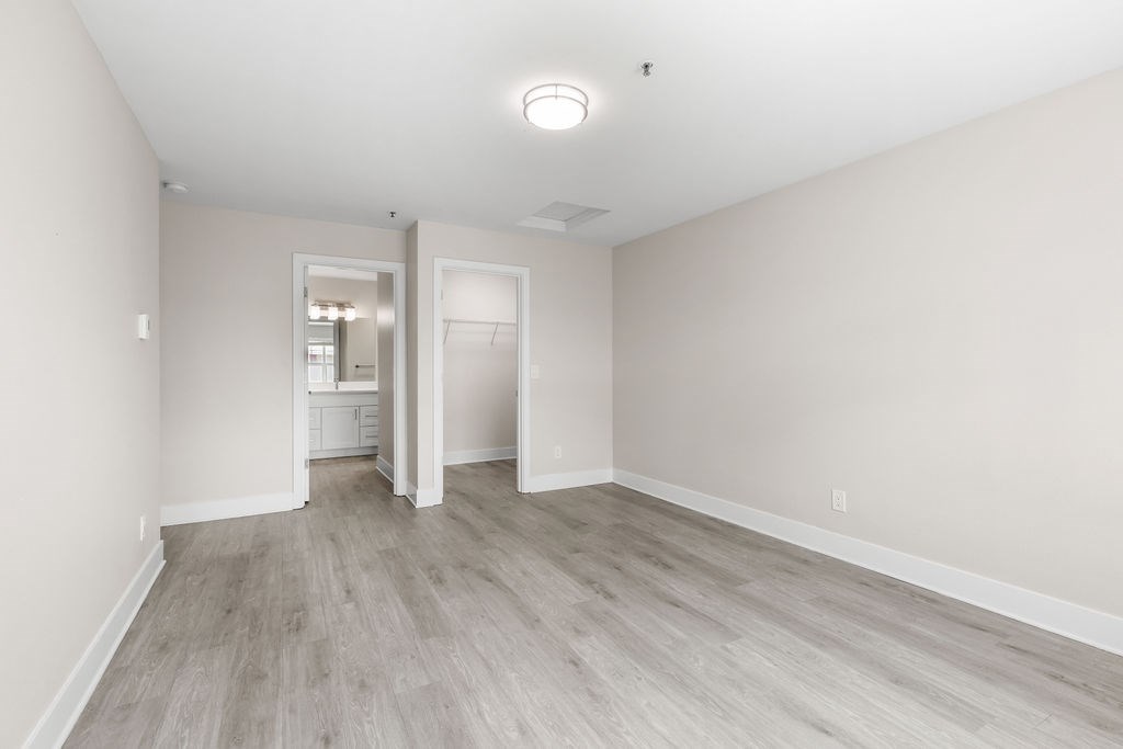 A room with a light grey floor and white walls.